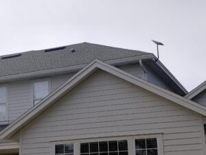 Home with Starlink antenna Mounted to the Fascia Board and cable point of entry through the attic