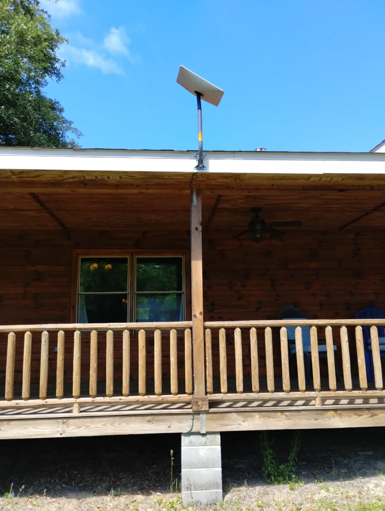 Home with Starlink antenna Mounted to the Fascia Board and outside cable run