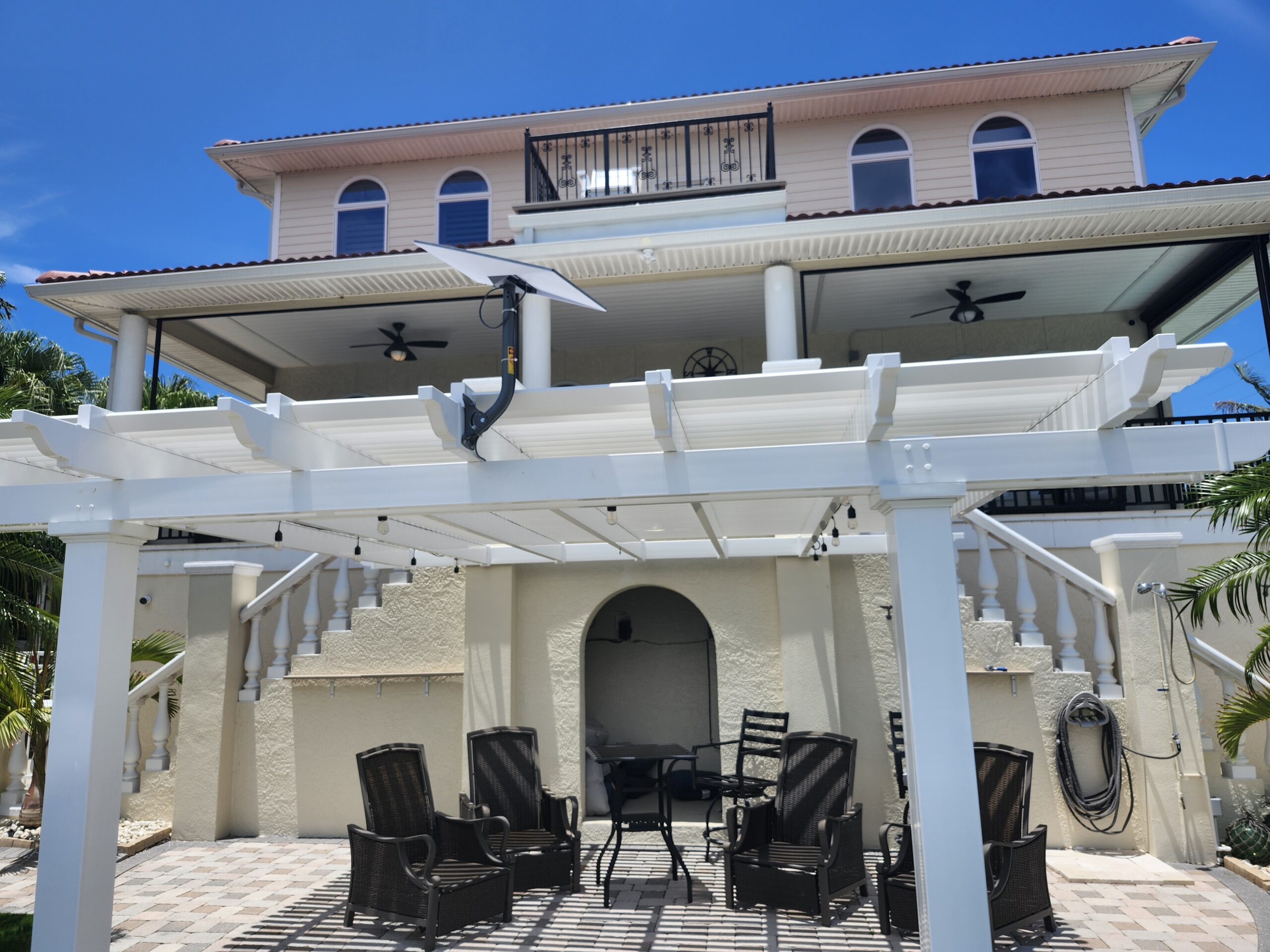 A Starlink Internet Antenna mounted to a roof. With a Outside cable run, down an outside wall, and a penetration through the wall that has a bushing and is siliconed.
Done by The Best Local Internet Company in Florida