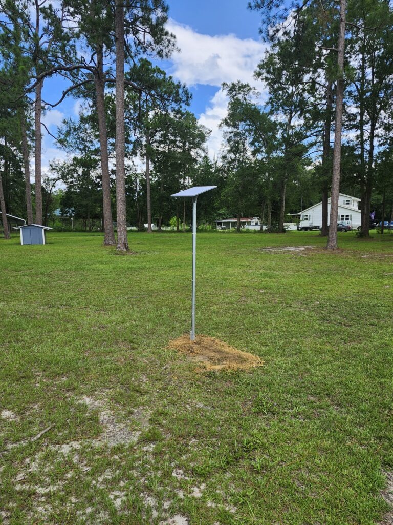 Starlink installed On a pole mount with the cable buried to the home.